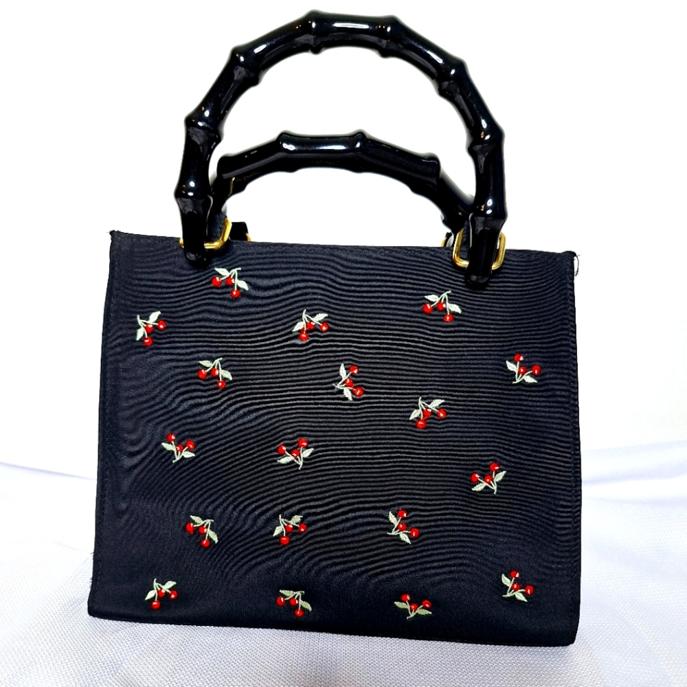 Vender brand "The Cherry Bomb" Dark Academia core bag.